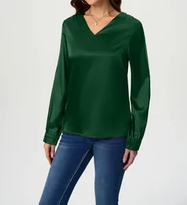 Elegant dark green satin long sleeve blouse featuring a classic V-neck on a fashion model