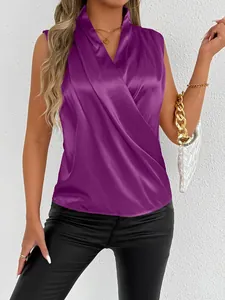 Detailed view of an elegant purple sleeveless satin blouse featuring a stylish wrap V-neck