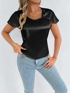 Detailed shot of a black satin short-sleeve top featuring high-gloss silk-like texture