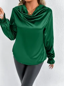 Detail shot of elegant dark green satin long sleeve blouse with draped cowl neck