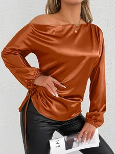 Detailed view of copper satin off-the-shoulder blouse with elegant ruched drawstring side