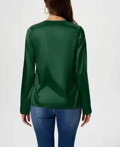 Back view of a dark green long-sleeved satin blouse with a smooth silk-like finish