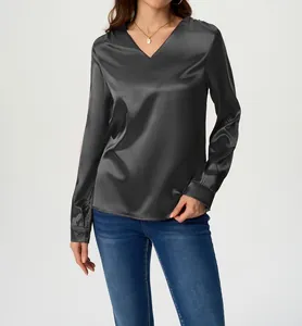 Detail view of smooth charcoal grey satin long sleeve V-neck blouse for elegant women