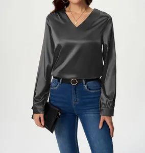 Elegant charcoal grey V-neck satin shirt detail showing smooth silk-like texture.