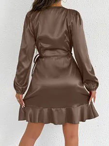 Back view of brown satin long-sleeved dress with elegant ruffle hem details