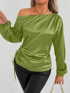 Detail view of an elegant olive green one-shoulder satin blouse with side drawstring