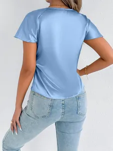 Back view of elegant light blue satin short sleeve top for women with silk-like texture