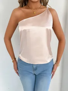 Elegant champagne satin one-shoulder top detail showing silky texture and slim fit