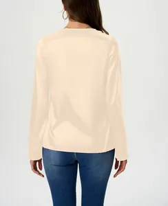 Back view of elegant long-sleeved satin blouse in cream with silky finish
