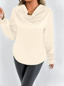 Close-up detail of cream satin cowl neck blouse showing the elegant ruffled cuffs