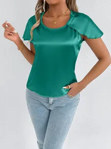 Detailed view of an elegant green satin short sleeve blouse with a smooth silk-like texture