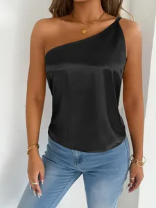 Close-up detail of an elegant black satin one-shoulder top showing smooth fabric texture
