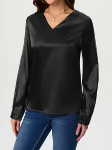Elegant black long-sleeve satin blouse with a V-neck for women in a studio setting