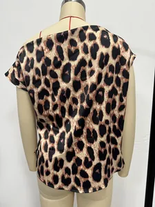 Detailed back view of a stylish leopard print satin blouse on a fashion dress form.