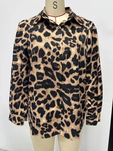 Close-up detail view of the leopard print satin long-sleeved shirt with brown buttons