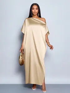 Full view of elegant champagne gold satin one-shoulder maxi dress showing drape and silhouette