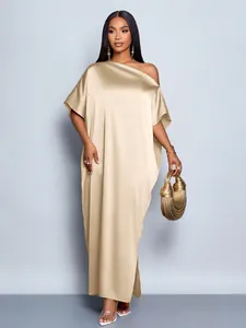 Elegant champagne gold satin one-shoulder maxi dress with a luxurious glossy finish