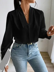 Detailed view of women's black satin V-neck shirt with elegant loose fit design
