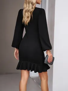 Back view of a chic black long sleeve bodycon dress with an elegant ruffled fishtail hem