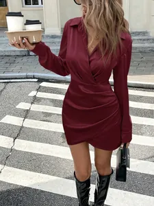 Elegant wine red satin long sleeve mini dress featuring a pleated waist and wrap V-neckline.