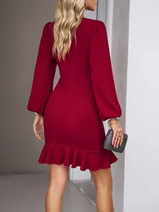 Detailed back view of a sophisticated long sleeve red bodycon dress with ruffled hem