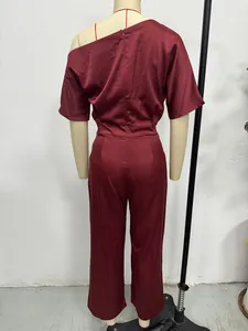 Back view of elegant burgundy satin jumpsuit with asymmetric one-shoulder design