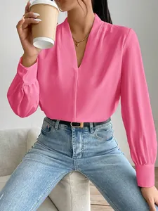Elegant pink satin V-neck blouse for women with a relaxed fit and long sleeves