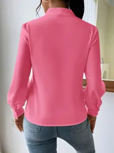 Back view of pink satin long sleeve blouse for women with loose fit and elegant style