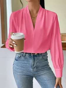 Elegant pink satin V-neck blouse for women with a silky sheen and relaxed fit styling