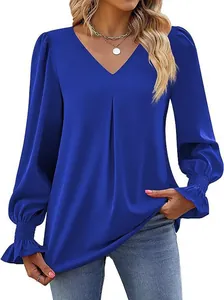 Detail view of blue satin V-neck blouse featuring smocked flared cuffs and pleats