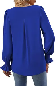 Back view of a vibrant blue satin blouse featuring elegant pleated lantern sleeves.