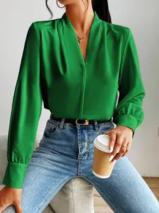 Elegant bright green satin blouse with a deep V-neck and stylish pleated long sleeves