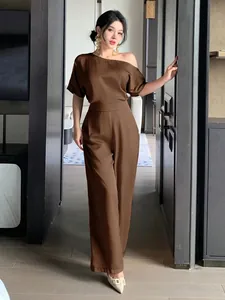 Elegant chocolate brown satin one-shoulder jumpsuit for women in a modern setting