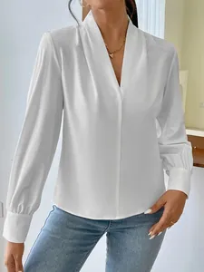 Macro view showing the smooth texture and elegant V-neckline of this white satin blouse