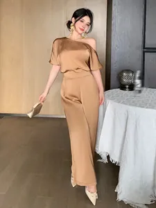 Elegant champagne gold satin jumpsuit featuring an asymmetric one-shoulder design detail