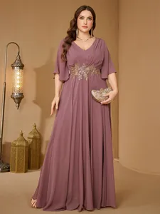 Elegant plus-size mauve evening gown featuring V-neck, ruffled sleeves and gold embroidery