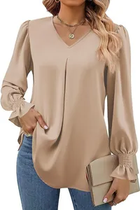 Close-up of elegant V-neck satin blouse with stylish smocked cuffs and long puff sleeves