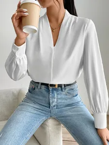 Chic white satin blouse featuring a V-neck and long puff sleeves for casual elegance.