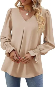 Detail view of a V-neck satin blouse featuring smocked flared cuffs and a pleated front