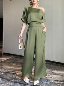 Full view of elegant olive green satin jumpsuit with asymmetric shoulder and wide legs