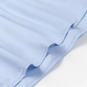 Detail of light blue strapless tube top showing high-quality double-stitched hem