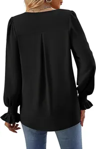 Back view of elegant black satin long sleeve blouse with bell cuffs and pleat detail