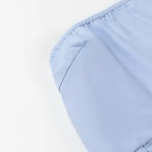 Close-up detail showing the high-quality fabric and elasticated edge of a light blue tube top