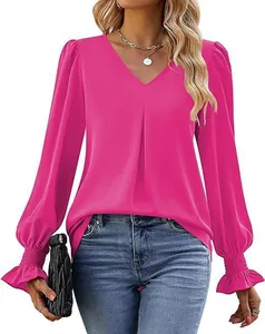 Elegant fuchsia satin V-neck blouse with lantern sleeves and smocked cuffs detail.