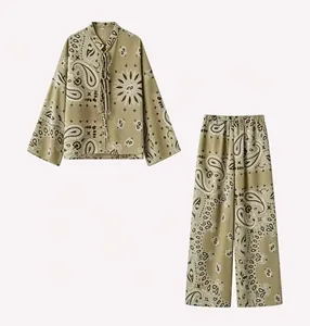 Two-piece women's set featuring a paisley print long-sleeve top and wide-leg pants
