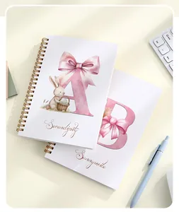 Close-up of Easter spiral notebook featuring a watercolor rabbit and pink bow design.