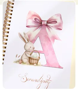 Close-up of Easter spiral notebook with watercolor bunny and pink letter A illustration
