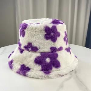 Close-up of the soft plush texture and purple floral pattern on white bucket hat