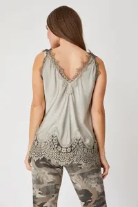 Back view of elegant sage green camisole with intricate lace trim and scalloped hem