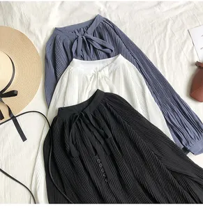 Elegant pleated chiffon blouses in black white and blue with bow tie neckline detail